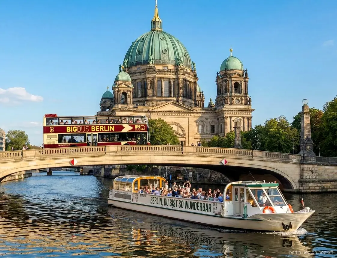 Big Bus Berlin hop on hop off bus crossing a bridge by Berlin Cathedral beside a Spree boat